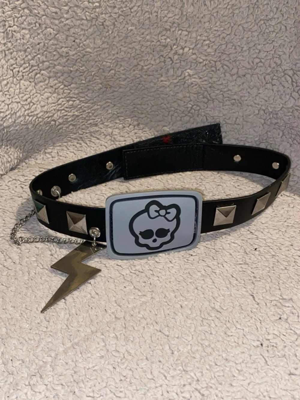 Monster High studded faux leather belt, notable for its iconic skull-and-bow